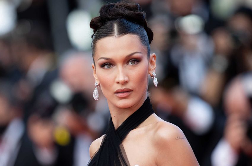  Bella Hadid transformed into a city-dwelling wild woman, wearing grandma galoshes and boy shorts