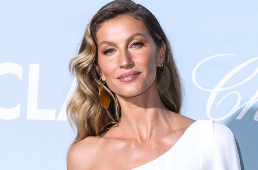  The guy next to her can’t take his eyes off such beauty. Gisele Bündchen, 42, walking down the street in a bra